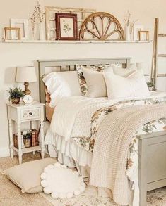 a bedroom with a bed, nightstands and pictures on the wall