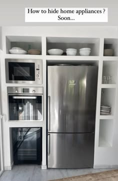 a stainless steel refrigerator freezer sitting inside of a kitchen