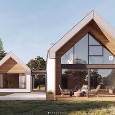 two wooden houses sitting on top of a lush green field