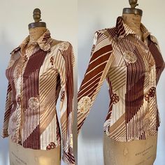 Great print on this 1970s top! Patterned Graphic Print Button-up Blouse, Retro Patterned Printed Shirt, Patterned Shirt With Vintage Print For Fall, Fitted Graphic Print Button-up Top, Fitted Patterned Printed Shirt, Vintage Fitted Printed Tops, Brown Graphic Print Button-up Top, Fitted Vintage Printed Tops, Retro Patterned Shirt With Vintage Print