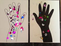 two handprints are shown with butterflies on them