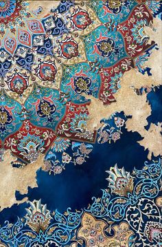 an intricately designed rug with blue and red colors