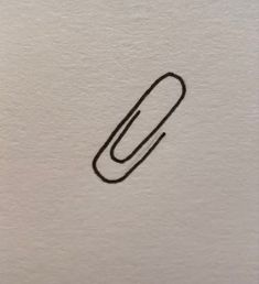 a drawing of a paperclip on a piece of white paper with black ink