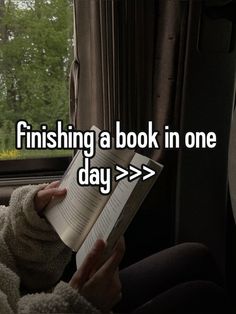 someone is reading a book in the back seat of a car, and it says finishing a book in one day