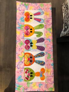 a table runner with colorful designs on it