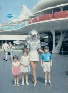 an old photo of some people and two children