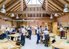 a group of men working in a woodworking shop