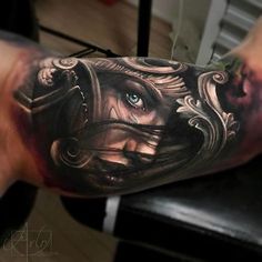 a man's arm with a tattoo on it and an eye in the center