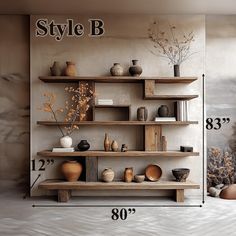 a shelf with vases and other items on it in front of a wall that says style b