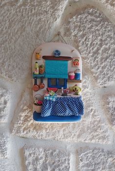 a wall hanging decoration with various items on it