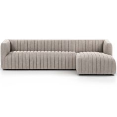 a gray couch sitting on top of a white floor