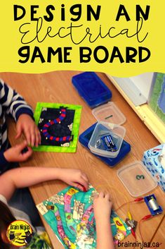 two children sitting on the floor playing with an electronic game board and some plastic containers