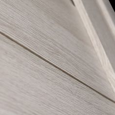 a close up view of the wood grains on a building's exterior door