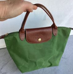 There’s some scratches scuffs and stains. Please see the photos carefully! It measures 12” wide (top) 8 1/2” long (without the handle) 5 1/2” deep Genuine LONGCHAMP Thanks for looking! Longchamp Bag, Green Tote, Small Tote Bag, Small Tote, Moss Green, Longchamp Le Pliage, Confetti, Bags Handbags, Shoe Accessories