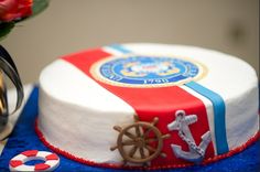 there is a cake that has been decorated with an anchor and ship wheel on it