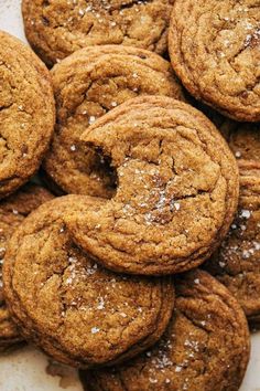 a pile of cookies sitting on top of a white plate