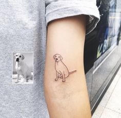 a small dog tattoo on the left arm and right arm with an image of a dog