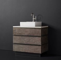 a bathroom sink sitting on top of a wooden cabinet next to a wall mounted faucet