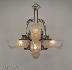 an art deco chandelier with glass shades