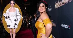 a woman in a yellow dress standing next to an image of herself on the red carpet