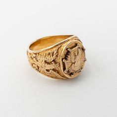 The design of this ring has been created for Catholic Bishops in Poland. Only selected were awarded with permission to wear it. Ring represents the Historic Polish White Eagle engraved on either side of the ring. The top design is an image of Our Lady of Czestochowa (Matka Boska Czestochowska) in front of Independence Eagle on top of the Scouts Badge. 14K Yellow Gold Ring face measures 0.562" x 0.687" Made in Poland Packaged in gift jewelry box. Gold prices fluctuate often. What you see online is today's price. 14K Yellow Gold Ring face measures 0.562" x 0.687" Made in Poland Packaged in gift jewelry box. Gold prices fluctuate often. What you see online is today's price. Our Lady Of Czestochowa, Black Madonna, White Eagle, Scout Badges, Eagle Ring, Mens Gold Jewelry, Mens Gold, Gold Price, Yellow Gold Ring