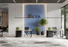 an office with two desks and chairs in front of a wall that says sota