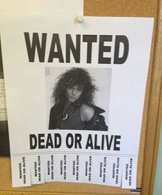 a wanted dead or alive sign posted on a bulletin board