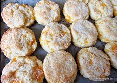 some biscuits that are sitting on a baking sheet and ready to be baked in the oven