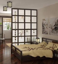 a bed sitting in a bedroom on top of a hard wood floor next to a window