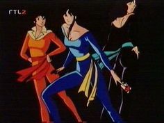 three women dressed in colorful clothing are dancing with their hands on hipss and legs crossed