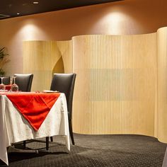 a dining room with tables and chairs is set up for a formal dinner or party