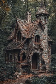 an old stone house in the woods