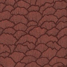 the texture of an upholstered fabric with red and brown patterns on it's surface