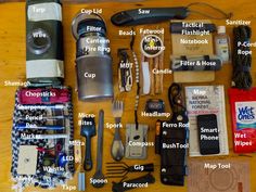 the contents of a camping kit laid out on a table