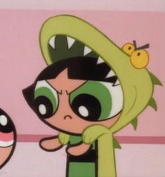 the powerpuff girls cartoon character is wearing a green hoodie and pointing to her face