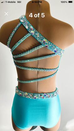 the back of a woman's bikinisuit with beads on it