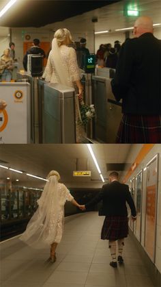 a man and woman in kilts are walking down the subway platform with their arms around each other