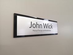 there is a sign on the wall that says john wick manual therapy and rehabilitation