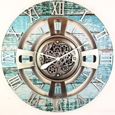 a clock with roman numerals on the face and blue wood grained background