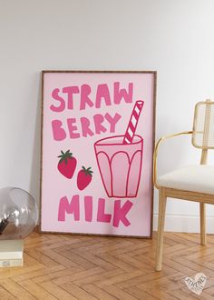 a pink poster with straw berry milk on it