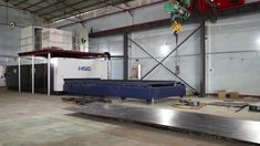 a large metal table in an industrial building