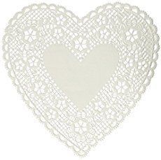 a white heart shaped doily on a white background