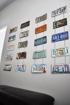 several license plates are hanging on the wall