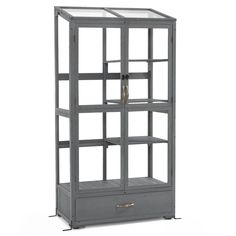 a gray bookcase with glass shelves and drawers on it's sides, against a white background