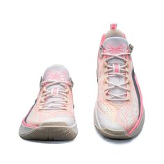 a pair of tennis shoes on a white background