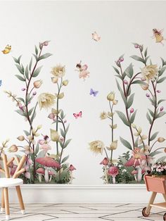 a room with flowers and butterflies painted on the wall next to a potted plant