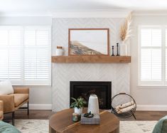 a living room filled with furniture and a fire place in front of a painting on the wall