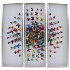 three framed artwork pieces with colorful butterflies on white paper and silver metal trimmings