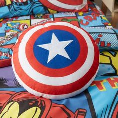 the captain's shield is on top of this bedding set, which has cartoon characters all over it