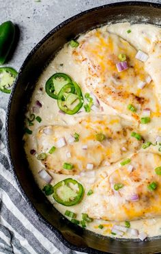 a skillet filled with cheese and green peppers